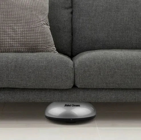 Silver automatic sweeping robot with compact 18cm by 18cm dimensions for floor cleaning
