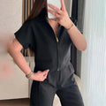 Loose fitting short sleeve casual top in polyester, shown in black colour.
