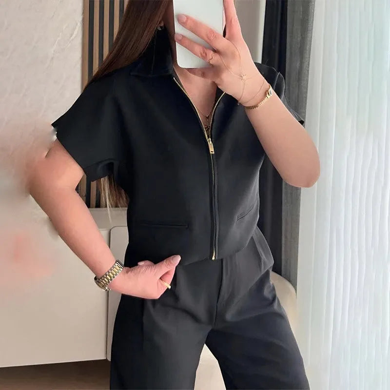 Loose fitting short sleeve casual top in polyester, shown in black colour.