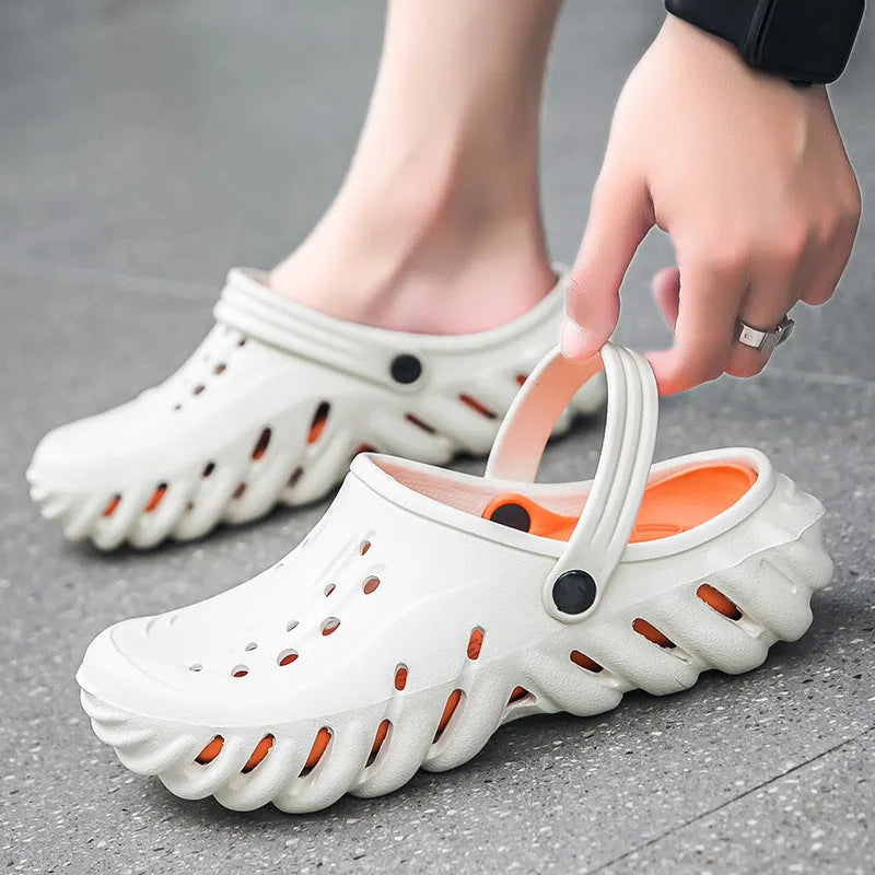 Men's beige EVA slipper sandals with a perforated hollow-out design and a round toe.