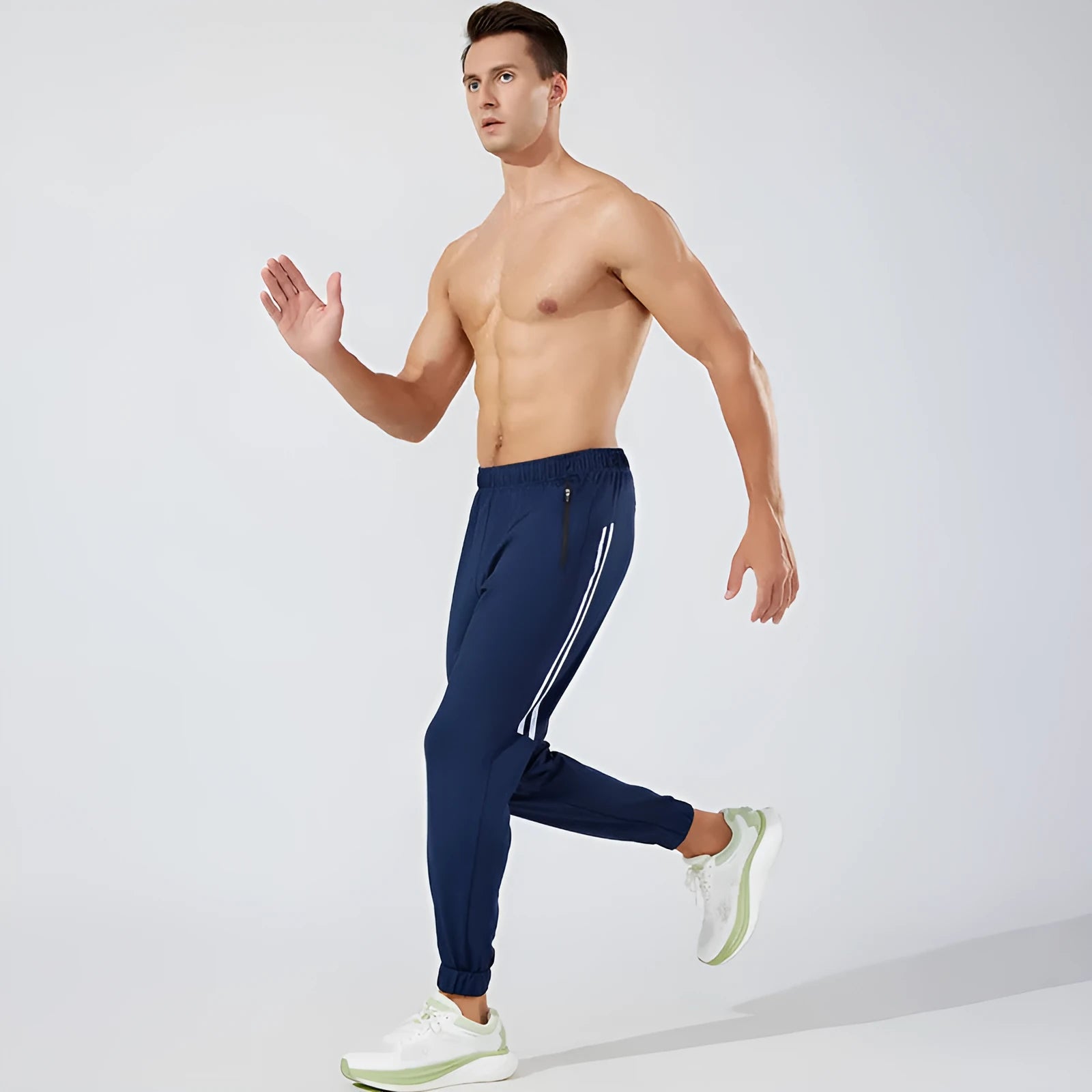 Black and navy blue men's polyester running trousers with mid waist.