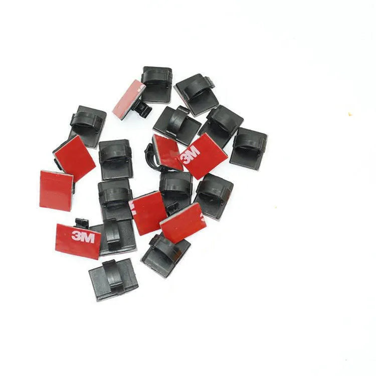 Plastic self-adhesive flat cable buckle clamp for automotive wire management in black or white.
