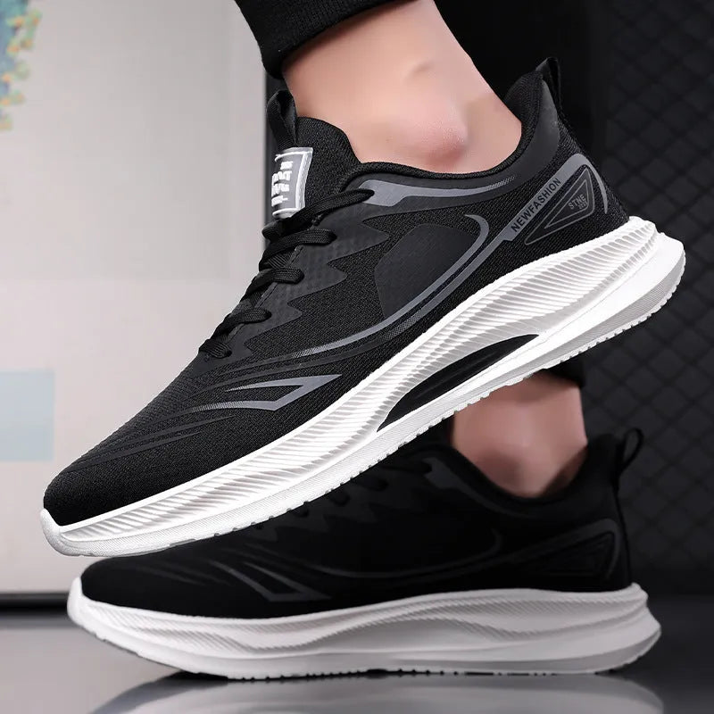 Men's lightweight black mesh casual trainers with a round toe and rubber sole on a plain background.
