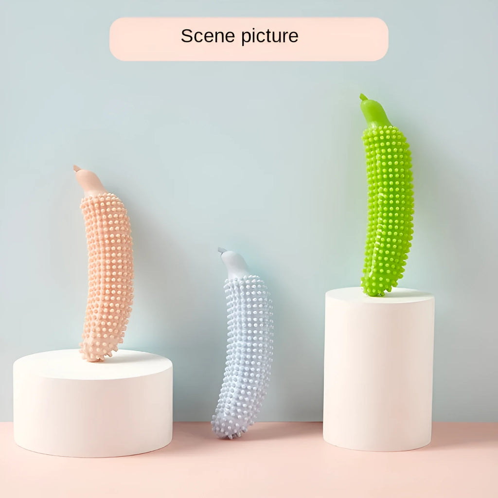 Green cucumber-shaped dog chew toy for teething and interactive play, approximately 20 cm long
