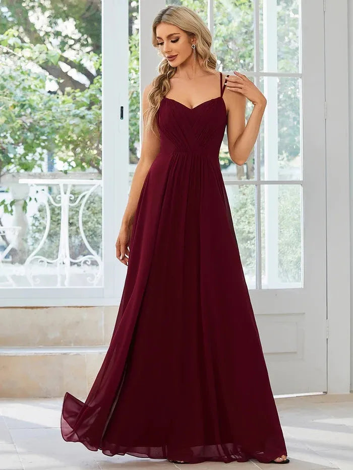 Women's sleeveless sling neckline banquet dress with long pleated A-line skirt
