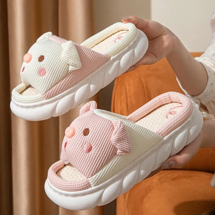 Pair of open-toe linen flip-flop slippers for couples on a plain background, showing colours and strap detail.