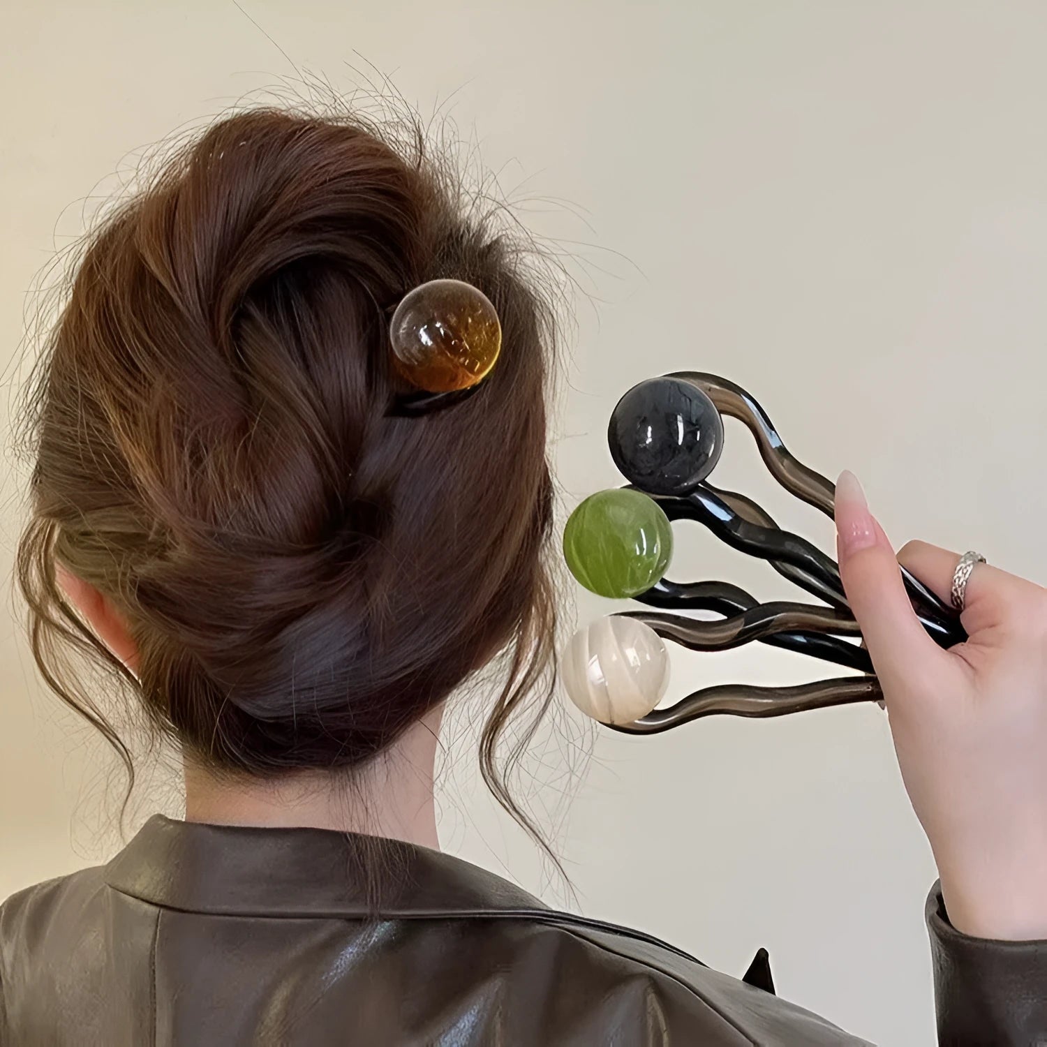 Acrylic U-shaped hair barrettes with ball decoration in beige, caramel, dark grey, and green colours