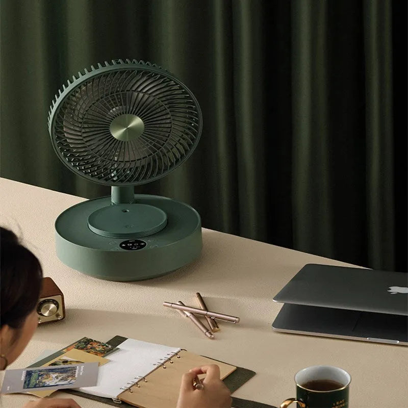 Green telescopic floor fan shown in both desktop and extended vertical positions with remote control