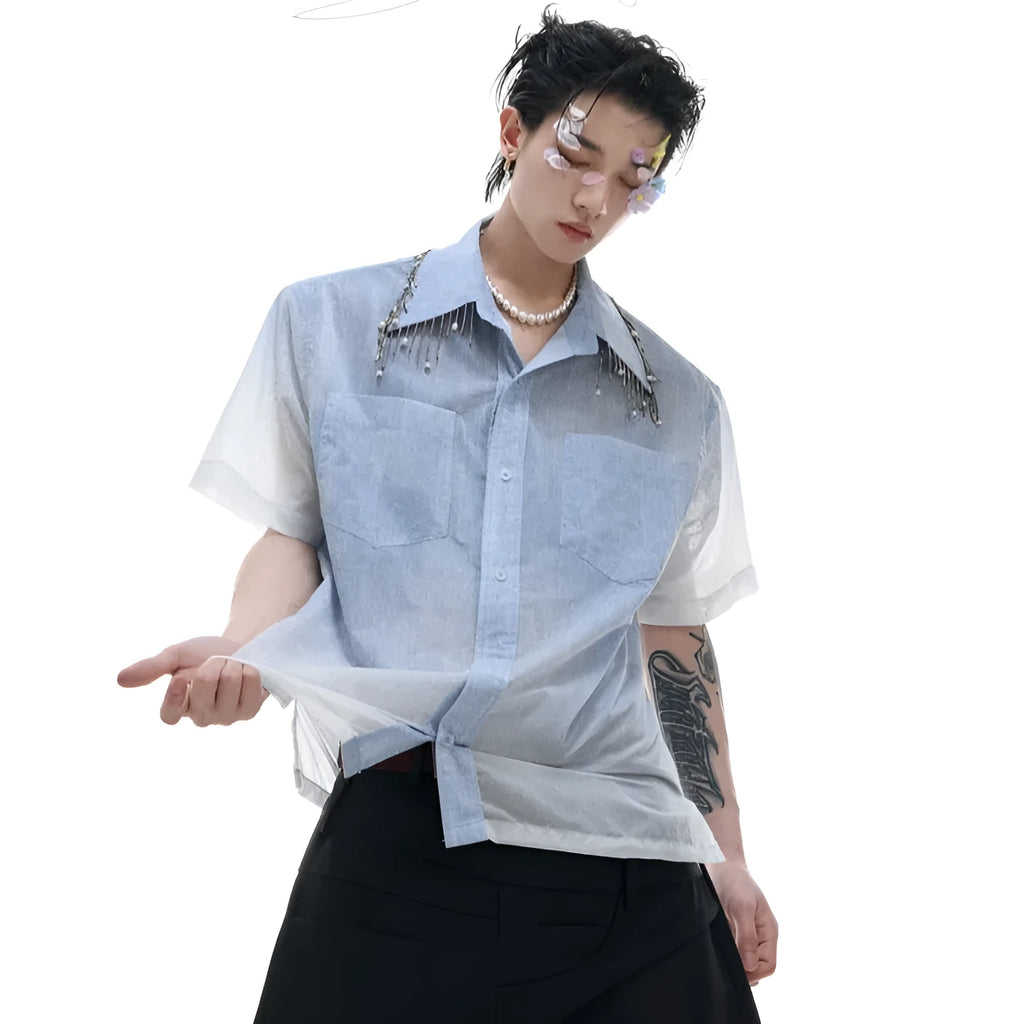 A blue and white gradient loose short-sleeve shirt on a hanger.