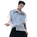 A blue and white gradient loose short-sleeve shirt on a hanger.