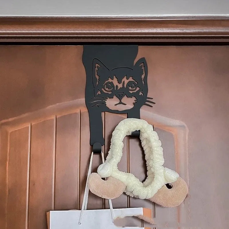 Black iron wall-mounted cat hook with modern design for punch-free installation.