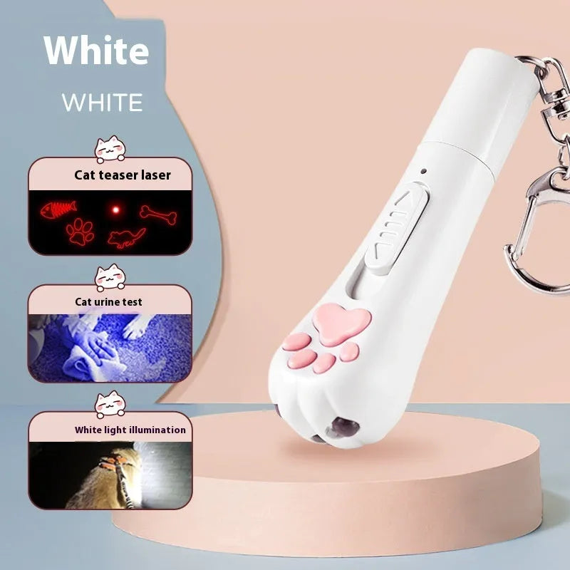 Pink self-playing cat teaser wand toy with USB charging cable on a table.