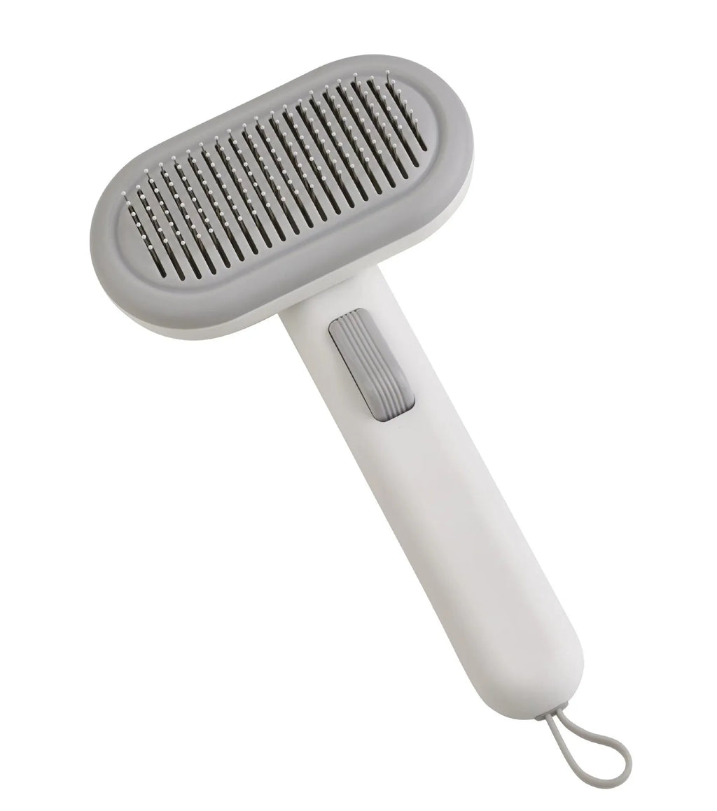 Large light grey pet hair removal comb with stainless steel blades and a one-click release button.