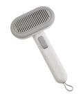 Large light grey pet hair removal comb with stainless steel blades and a one-click release button.