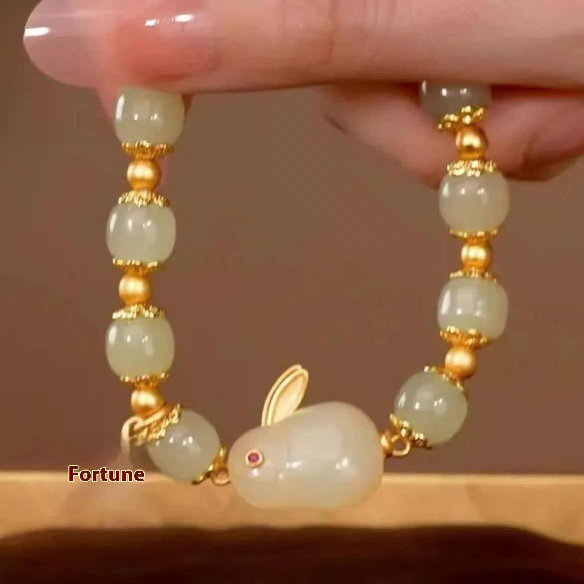 Green mixed-material jade hare bracelet with electroplated finish and lily decorative elements