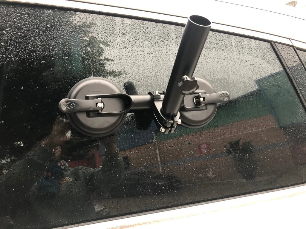 Black off-road car sucker base with round rubber suction cup for mounting on vehicle windows.