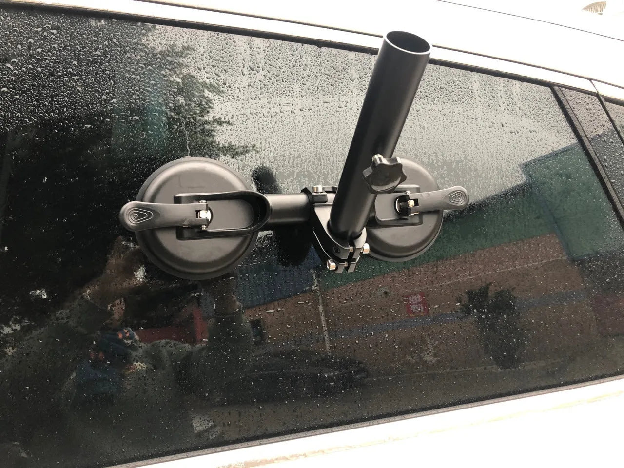 Black off-road car sucker base with round rubber suction cup for mounting on vehicle windows.