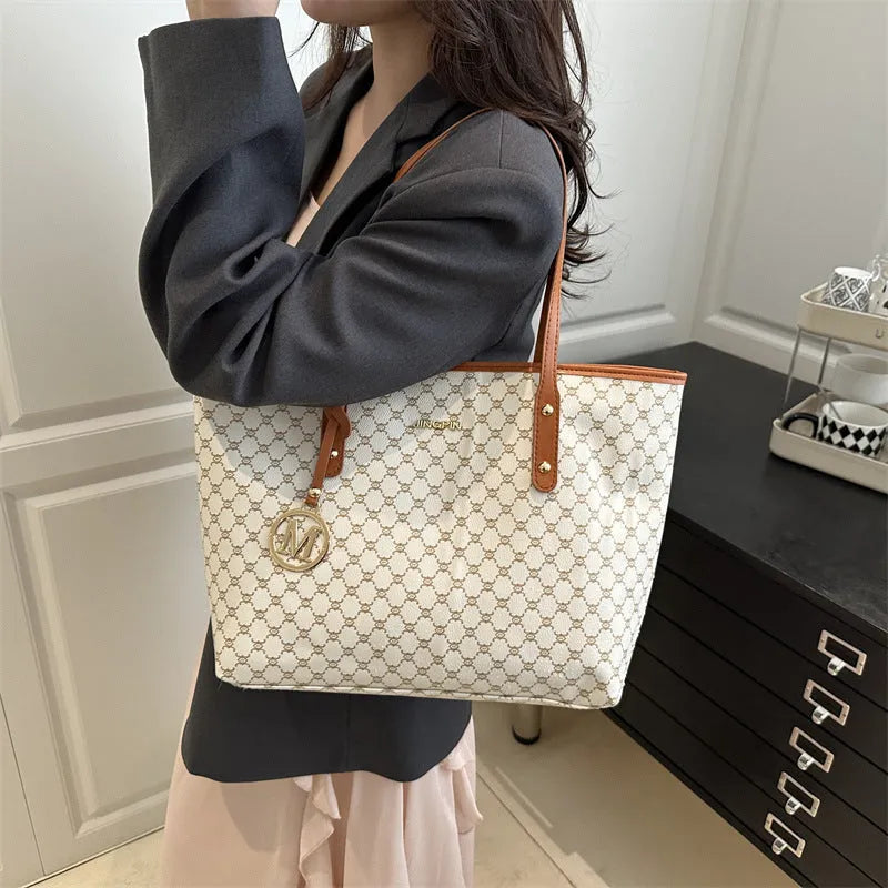 Black PU shoulder bag with sewing thread detail, showing interior polyester lining.