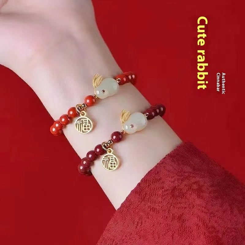 Purple gold sand cinnabar bracelet with a jade hare charm, shown in 6mm and 8mm bead sizes.