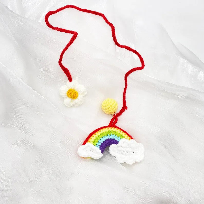 Handmade crocheted avocado rainbow flower car pendant made from wool yarn.