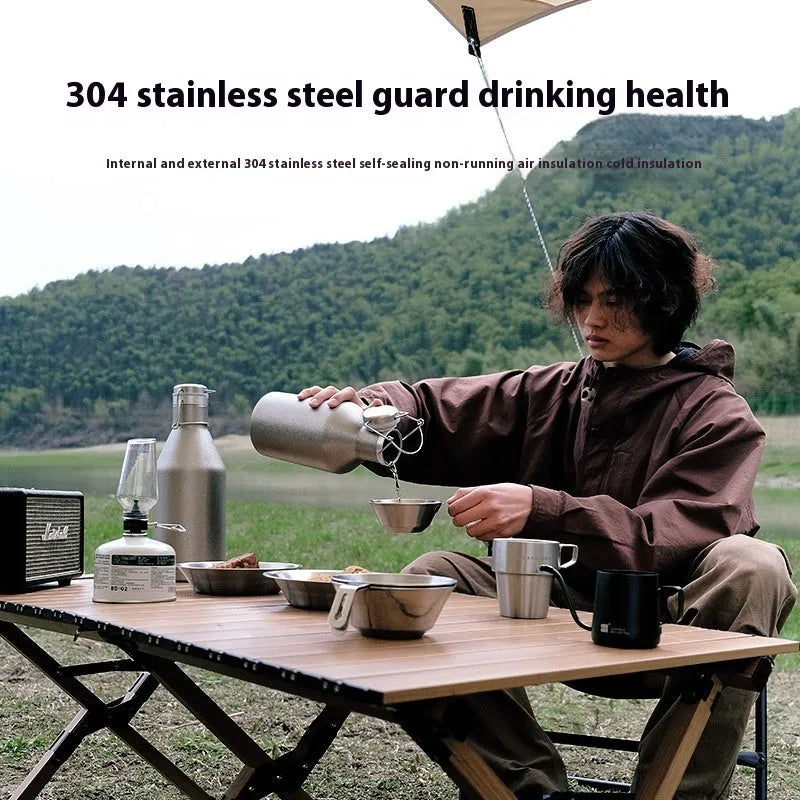 Stainless steel thermal pot with large capacity for outdoor and portable use.