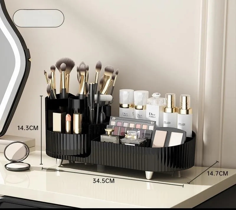 Rotating cream and black cosmetics organiser box holding makeup brushes and lipsticks on a table.