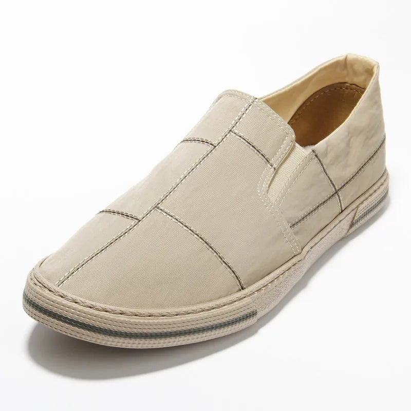 Men's low-top slip-on canvas shoes in khaki colour with round toe and vulcanised rubber sole.