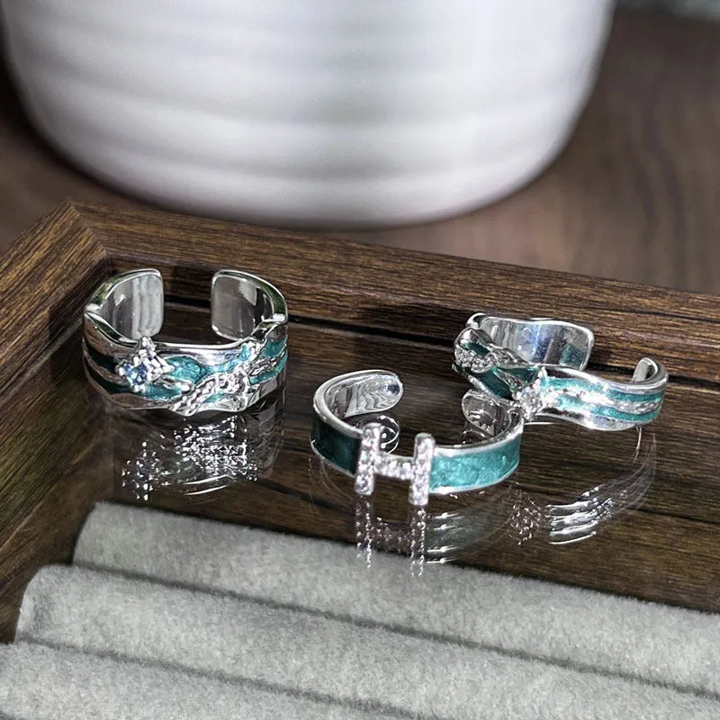 Mint green enamel astrology star ring with asymmetrical folded design on copper base