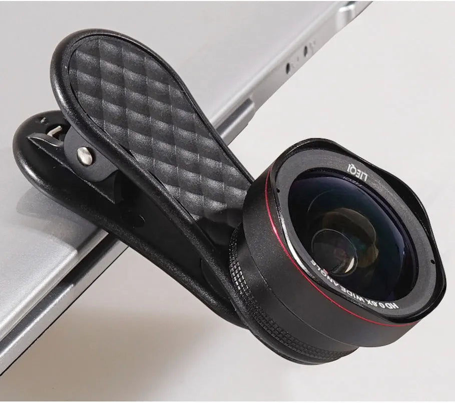 Mobile phone lens kit showing 0.6X wide-angle lens, 15X macro lens, clip attachment, storage case and cleaning cloth