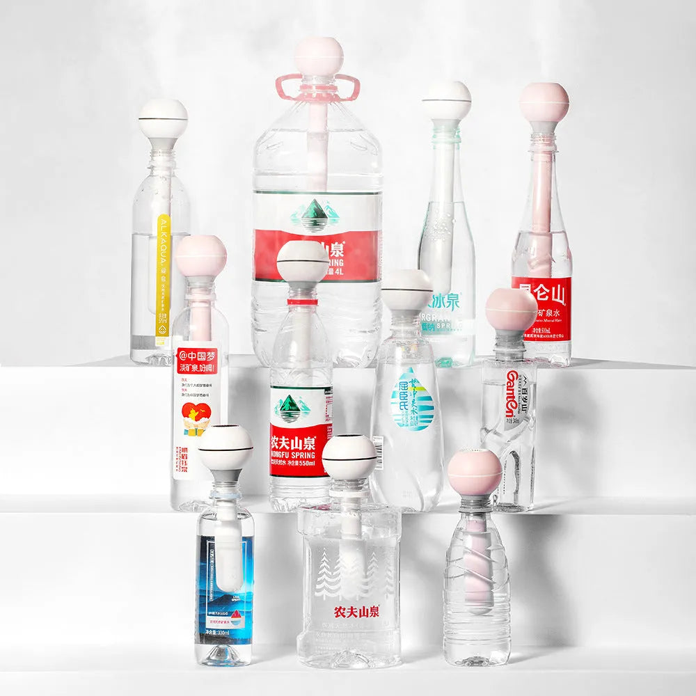 Columnar pink and white magic wand ultrasonic humidifier with 1 litre tank for desktop use.
