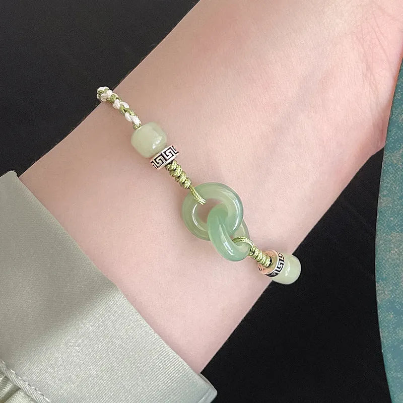 Women's ethnic style copper bracelet with peace buckle and double ring design in green.