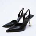 Women's nude apricot pointed toe patent leather high heels on a white background.