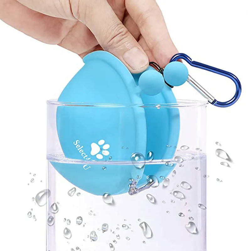 Silicone dog training treat pouch with waist clip in assorted colours on a belt.