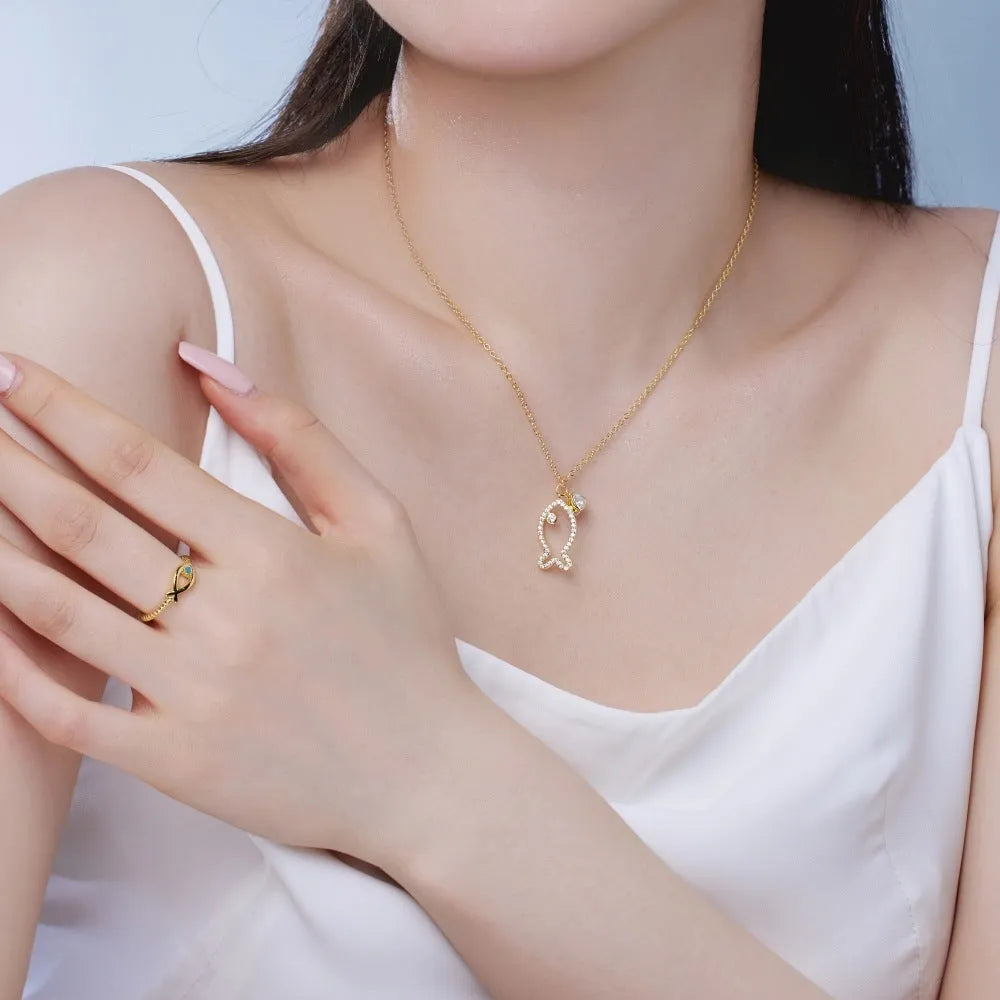 S925 sterling silver clavicle necklace with hollow fish pendant, zircon detail, and koi motif in gold or platinum.