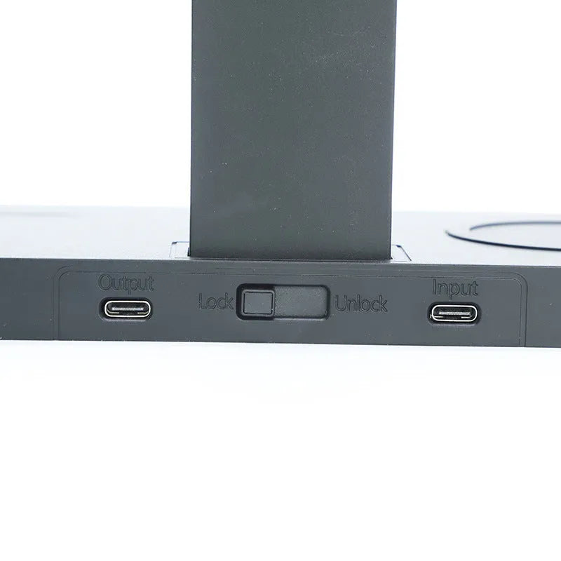 Matte black wireless charging station with three charging pads for mobile phone, smartwatch and headphones