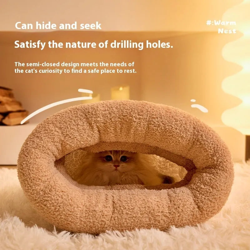 Brown plush semi-enclosed cat sleeping bag with thick stripes, shown on a floor.