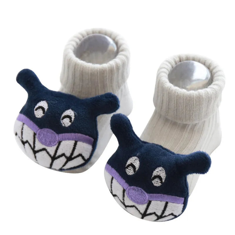 Cotton baby socks in multiple colours and designs including a panda pattern and a blue bow.