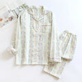Women's red fruit print cotton gauze long-sleeved top and trousers two-piece loungewear set laid flat.