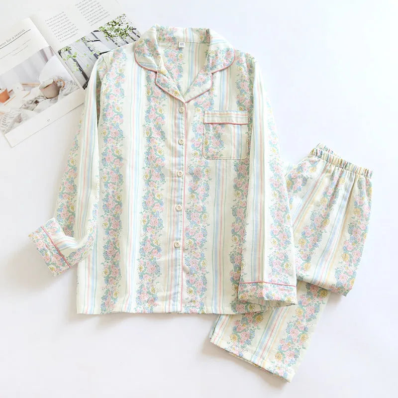 Women's red fruit print cotton gauze long-sleeved top and trousers two-piece loungewear set laid flat.