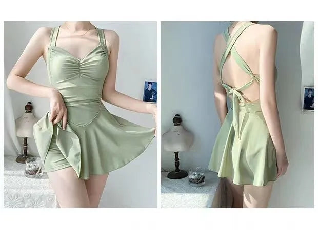 Women's solid colour conservative one-piece swimsuit with backless design