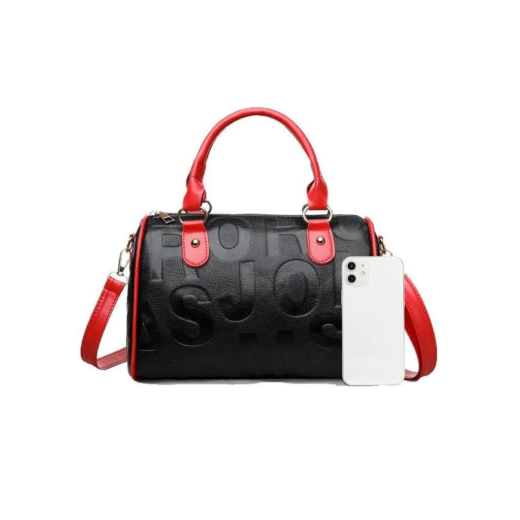 Brown cylindrical PU leather crossbody bag with three shoulder straps showing interior polyester lining