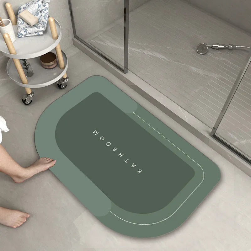 Cushioned oval and rectangular floor mats in blue, grey, and green colours on a wooden floor.