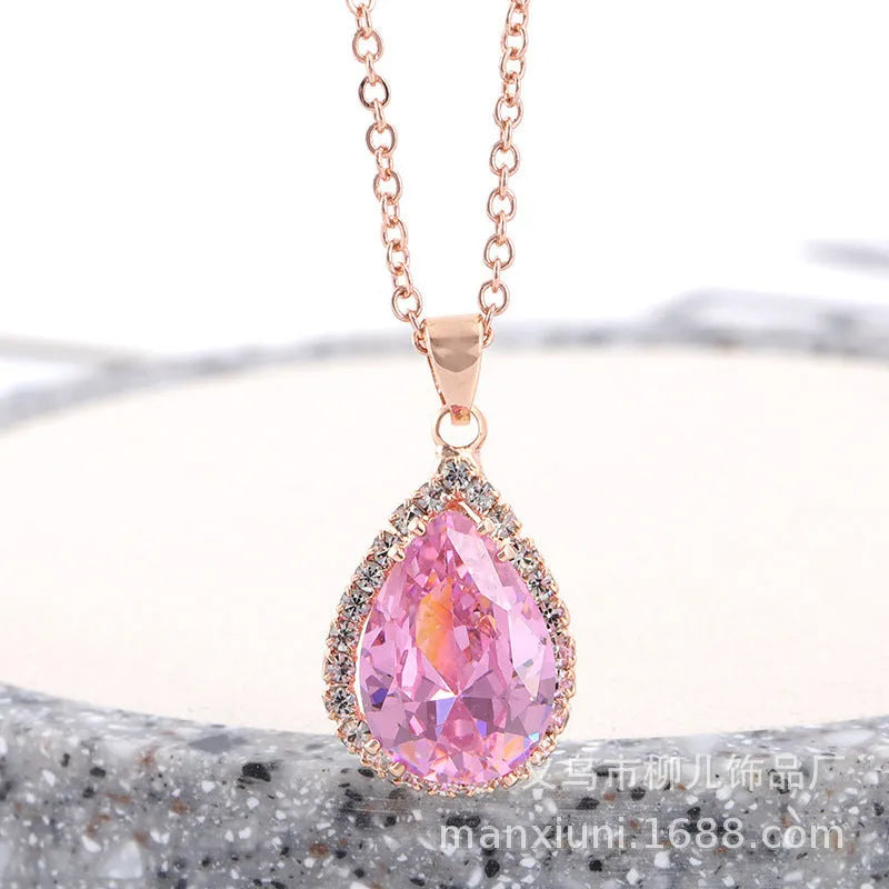 Geometric drop shape alloy necklace with rhinestone accents in rose gold pink finish