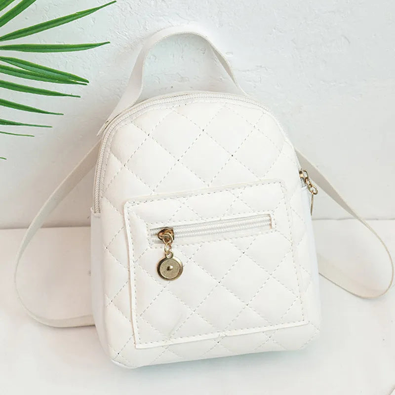 Girls' hard square PU backpack with embroidery in pink, showing front sandwich pocket and carry handle.