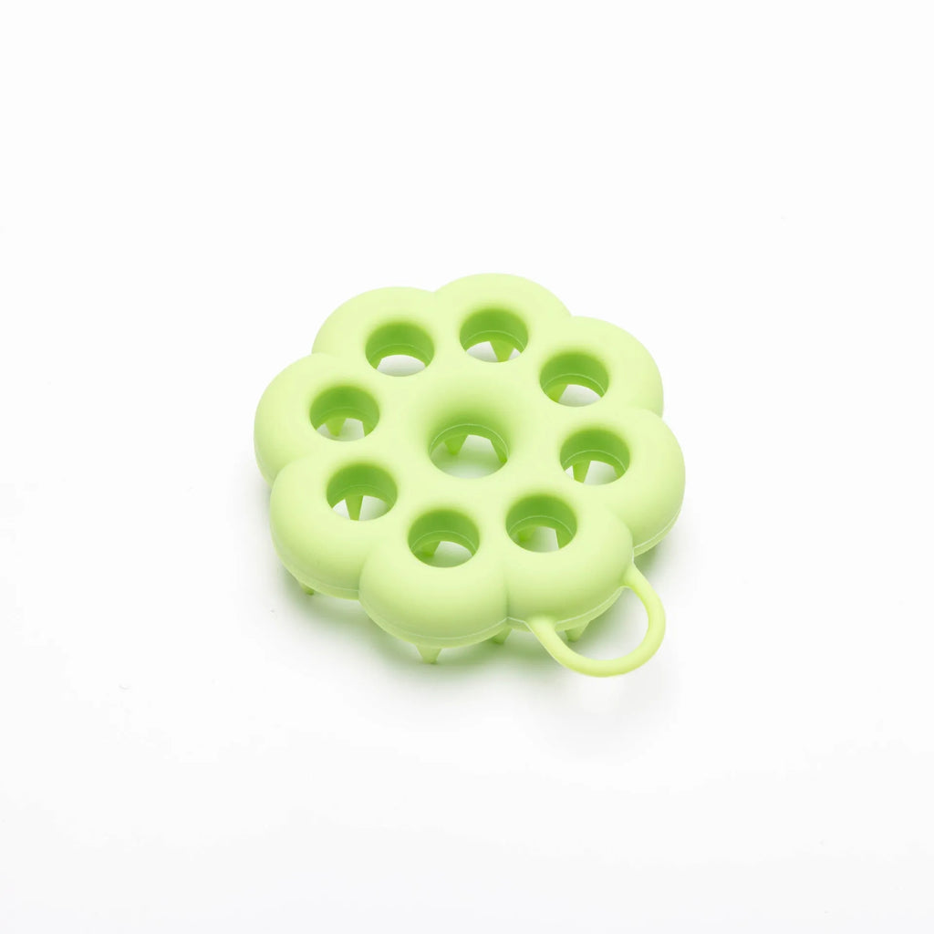 Silicone pet grooming brush with coloured ergonomic handle and flexible massage bristles for dogs and cats.