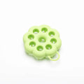 Silicone pet grooming brush with coloured ergonomic handle and flexible massage bristles for dogs and cats.