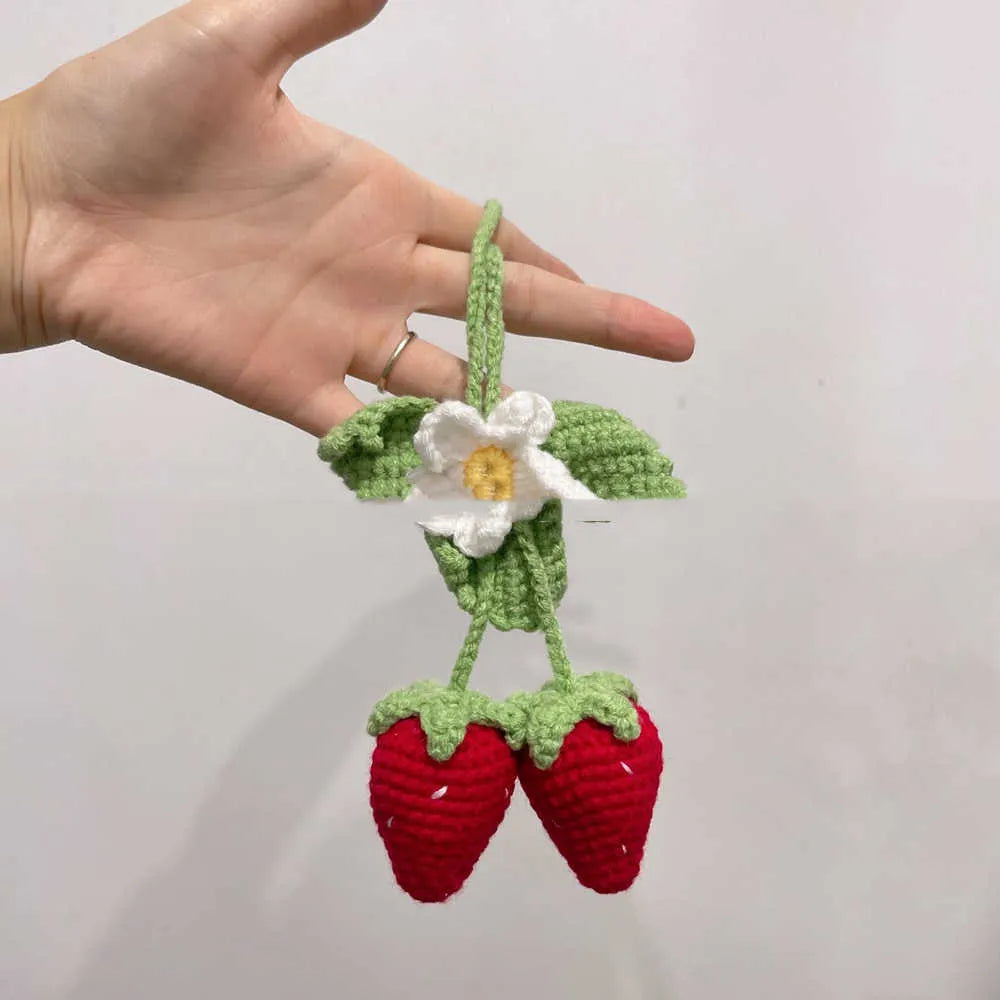 Handmade woven strawberry car pendant made from cotton and hemp knitting wool.