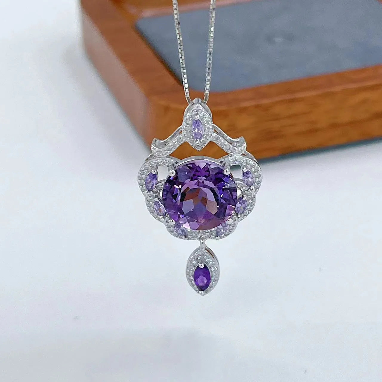 Purple amethyst stone set in silver U-shaped pendant with meteor shower pattern decoration