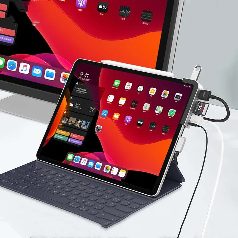 Silver aluminium grey Type-C 6-in-1 docking station for iPad Pro, showing multiple ports.