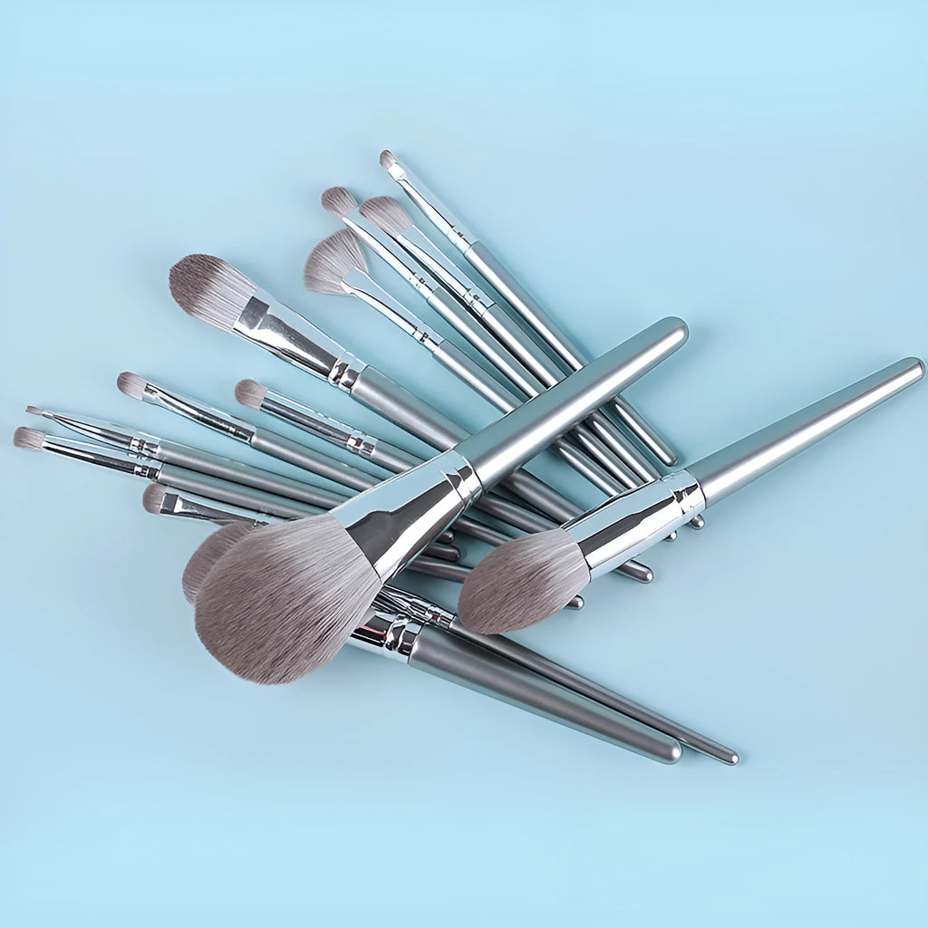 14 piece wooden handle makeup brush set with soft artificial fibre bristles in various brush shapes on a neutral background